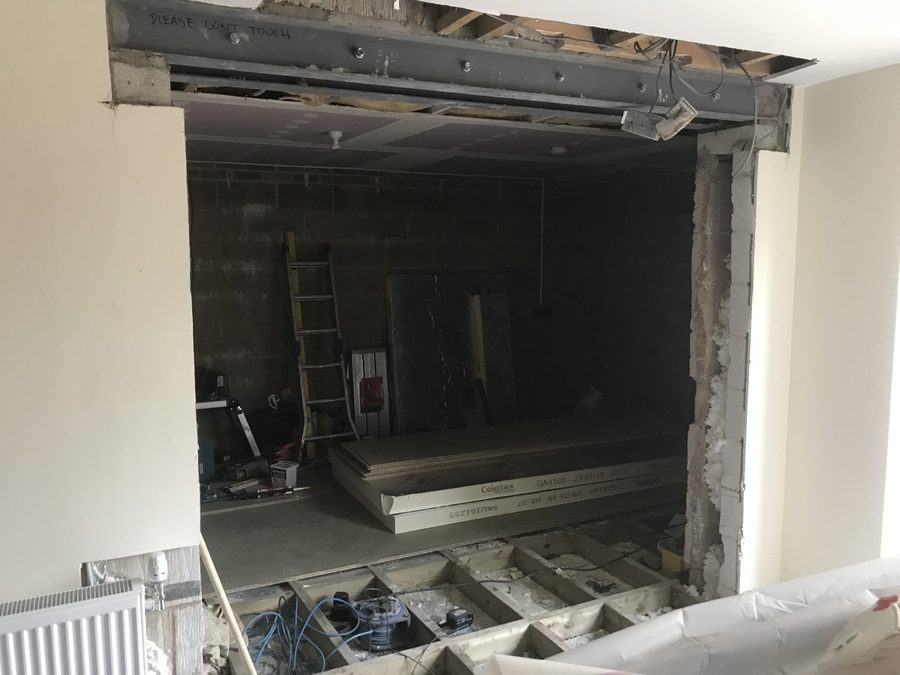 Structural opening formed in a wall, propped and ready for the new steel